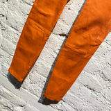UNRAVEL PROJECT ORANGE HIGH WAISTED LEATHER TROUSERS