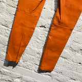 UNRAVEL PROJECT ORANGE HIGH WAISTED LEATHER TROUSERS