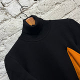 JW ANDERSON 
BLACK/ORANGE KNIT JUMPER