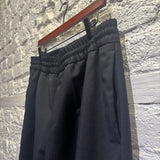 ACNE STUDIOS	BLACK UNLINED SUIT