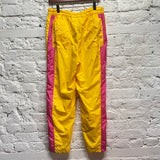 COMME DES GARÇONS 
COMME DES GARÇONS SHIRT
YELLOW/PINK SHELL TRACK PANTS
