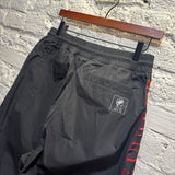MCQ	BLACK ""UNIT DRONE"" PIPING TRACK BOTTOMS