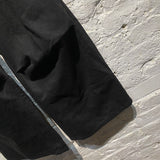 RAF SIMONS BLACK OVERSIZE DENIM TROUSERS WITH EYELETS