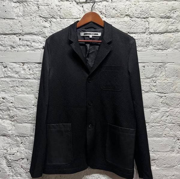 ALEXANDER MCQUEEN
MCQ
BLACK WOOL JACKET WITH LEATHER POCKETS