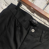 JUNYA WATANABE BLACK COTTON TROUSERS WITH BUTTON DETAILS