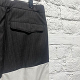 RAF SIMONS 
SAMPLE RECONSTRUCTED PINSTRIPE WOOL/WHITE COTTON TROUSERS