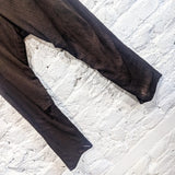 OLUBIYI THOMAS
BROWN OVER DYED HAND WAXED BOW LEGGED MUSLIN TROUSERS