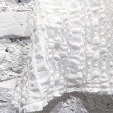 OLUBIYI THOMAS 
REVERSIBLE HALTER NECK TOP IN WHITE LACE/ FLORAL JACQUARD