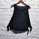 ALEXANDER McQUEEN	 black tabard vest with embroidered badge
ONE SIZE