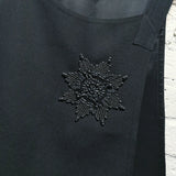 ALEXANDER McQUEEN	 black tabard vest with embroidered badge
ONE SIZE