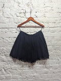 CARVEN 
BLACK PLEATED SQUARE CUT OUT MINI SKIRT