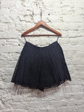 CARVEN 
BLACK PLEATED SQUARE CUT OUT MINI SKIRT